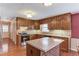 Functional kitchen with updated appliances, island, and ample cabinet space at 3550 Miller Farms Ln, Peachtree Corners, GA 30096