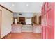 Bright living room with a brick fireplace, ceiling fan, built-in shelves, and wood floors at 3550 Miller Farms Ln, Peachtree Corners, GA 30096