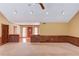 Spacious living room with neutral carpet, recessed lighting, and entry to foyer with brick accents at 3550 Miller Farms Ln, Peachtree Corners, GA 30096