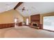 Bright and airy living room features a fireplace, wet bar, and access to the dining area at 3550 Miller Farms Ln, Peachtree Corners, GA 30096