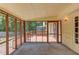 Enclosed porch with large screened windows providing ample natural light and views of the backyard at 3550 Miller Farms Ln, Peachtree Corners, GA 30096
