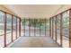 Relaxing screened porch with views of the backyard and surrounding greenery at 3550 Miller Farms Ln, Peachtree Corners, GA 30096