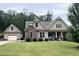 Beautiful house with stone accents, attached garage, well-manicured lawn, and lovely landscaping at 37 Grand Georgian Ne Ct, Cartersville, GA 30121