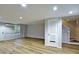 Finished basement with hardwood floors, ample lighting, and access to stairs at 6927 Gallant Se Cir # 11, Mableton, GA 30126