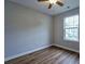 Comfortable bedroom with hardwood floors, natural light, and neutral walls at 6927 Gallant Se Cir # 11, Mableton, GA 30126