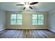 Spacious bedroom with hardwood floors, natural light, and ceiling fan at 6927 Gallant Se Cir # 11, Mableton, GA 30126