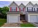 Charming townhome featuring attached garages, gray siding, and symmetrical window design at 6927 Gallant Se Cir # 11, Mableton, GA 30126