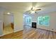 Inviting living space featuring wood floors, fireplace, and access to the outdoor deck at 6927 Gallant Se Cir # 11, Mableton, GA 30126