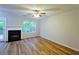 Bright living room features a fireplace, wood floors, and large windows at 6927 Gallant Se Cir # 11, Mableton, GA 30126
