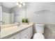Bathroom featuring a single sink vanity and toilet against decorative tile at 2722 Spring Side Ct, Douglasville, GA 30135