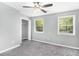 Bright bedroom with natural light, ceiling fan, closet, and neutral-toned walls at 2722 Spring Side Ct, Douglasville, GA 30135