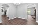 Bright dining room featuring modern chandelier, wood floors, and easy access to other rooms at 2722 Spring Side Ct, Douglasville, GA 30135