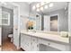 Bright bathroom featuring a large vanity, neutral color palette, and tiled floors at 2722 Springside Ct, Douglasville, GA 30135