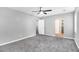 Spacious bedroom with neutral walls, carpeting, a ceiling fan, and natural light from windows at 2722 Springside Ct, Douglasville, GA 30135