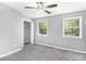 Bright bedroom with a ceiling fan, closet, and two windows that offer natural light at 2722 Springside Ct, Douglasville, GA 30135