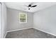 Bedroom with neutral paint, carpet, ceiling fan, and a window with natural light at 2722 Springside Ct, Douglasville, GA 30135