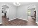 Bright dining room featuring hardwood floors, modern chandelier, and arched doorways at 2722 Springside Ct, Douglasville, GA 30135