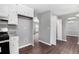 Bright kitchen with white cabinets and stainless appliances and an archway into dining area at 2722 Springside Ct, Douglasville, GA 30135