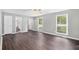 Spacious living room with hardwood floors and bright, natural light from the windows at 2722 Springside Ct, Douglasville, GA 30135