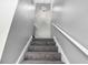 Carpeted staircase features a white handrail and modern globe lighting at 2722 Springside Ct, Douglasville, GA 30135