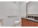 This renovated bathroom features an updated vanity with a dark counter and comfort-access toilet at 4621 Lakeshore Dr, Pine Lake, GA 30072
