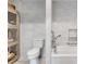 The renovated bathroom features modern fixtures, stone grey tile, and an open shower/tub at 4621 Lakeshore Dr, Pine Lake, GA 30072