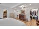 This spacious bedroom showcases hardwood floors, a ceiling fan, and walk in closet at 4621 Lakeshore Dr, Pine Lake, GA 30072