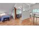Cozy bedroom and living space featuring hardwood floors and natural light at 4621 Lakeshore Dr, Pine Lake, GA 30072