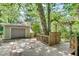 Detached garage with ample parking and a charming trellis feature at 4621 Lakeshore Dr, Pine Lake, GA 30072