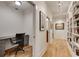 Hallway with floor to ceiling bookshelf with access to the home office at 4621 Lakeshore Dr, Pine Lake, GA 30072
