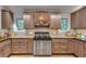 This kitchen has wooden counters, wooden cabinets and stainless steel stove at 4621 Lakeshore Dr, Pine Lake, GA 30072