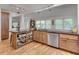 Efficient kitchen layout with bar seating, an open design, and abundant natural light at 4621 Lakeshore Dr, Pine Lake, GA 30072