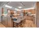 Spacious kitchen featuring custom cabinets, a large island with seating, and stainless steel appliances at 4621 Lakeshore Dr, Pine Lake, GA 30072