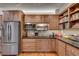 Well-appointed kitchen with stainless steel appliances, ample storage, and modern lighting fixtures at 4621 Lakeshore Dr, Pine Lake, GA 30072