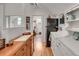 The kitchenette features a sink, shelving, and a stainless steel fridge at 4621 Lakeshore Dr, Pine Lake, GA 30072