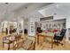 Bright living room featuring hardwood floors, a skylight, and open access to the kitchen at 4621 Lakeshore Dr, Pine Lake, GA 30072