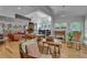 Spacious living room with fireplace, built-in bookshelves, and ample natural light at 4621 Lakeshore Dr, Pine Lake, GA 30072