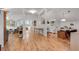 Spacious living area with hardwood floors, white walls, and natural light throughout at 4621 Lakeshore Dr, Pine Lake, GA 30072
