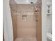 This bathroom features a tiled shower with a decorative tile accent and a built-in niche at 4621 Lakeshore Dr, Pine Lake, GA 30072