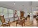 Bright sitting room with hard wood floors and lots of sunlight shining through multiple windows at 4621 Lakeshore Dr, Pine Lake, GA 30072