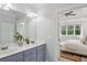 En-suite bathroom featuring a double vanity and access to the primary bedroom at 47 Oakridge Se Ave, Atlanta, GA 30317