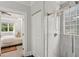 En-suite bathroom featuring a glass-enclosed shower and bedroom access at 47 Oakridge Se Ave, Atlanta, GA 30317