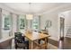 Bright dining room features hardwood floors, large windows, and modern light fixture at 47 Oakridge Se Ave, Atlanta, GA 30317