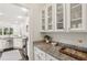 Bright white kitchen features granite counters and stainless steel appliances at 47 Oakridge Se Ave, Atlanta, GA 30317