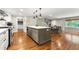 Elegant kitchen with stainless appliances and island seating open to the dining area, great for gatherings at 1050 Lake Charles Dr, Roswell, GA 30075