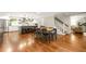 Open kitchen and dining area with stainless steel appliances, a central island, and a large dining table at 1050 Lake Charles Dr, Roswell, GA 30075