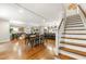 Spacious living and dining area with hardwood floors and open floor plan leading to the kitchen and stairs at 1050 Lake Charles Dr, Roswell, GA 30075