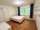 Bedroom with hardwood floors, a window with outdoor views, and closet at 1333 Council Bluff Ne Dr, Atlanta, GA 30345