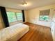 Bedroom featuring hardwood floors and natural light streaming through the windows at 1333 Council Bluff Ne Dr, Atlanta, GA 30345