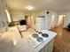 Functional kitchen featuring white cabinets, white appliances, and tile backsplash at 1333 Council Bluff Ne Dr, Atlanta, GA 30345